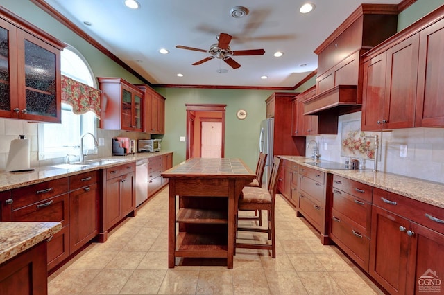 52 Hadley Dr, New Baltimore, NY 12087 - kitchen with appliances with stainless steel finishes, ceiling fan, a sink, backsplash, and ornamental molding