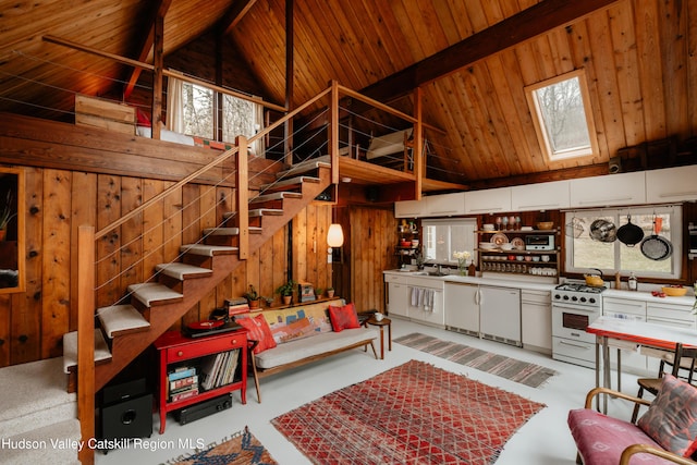living area featuring wood ceiling, high vaulted ceiling, and a skylight