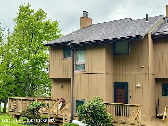 72 Hunter Dr Unit L-1, Hunter, NY 12442 - back of property with roof with shingles, a chimney, and a deck