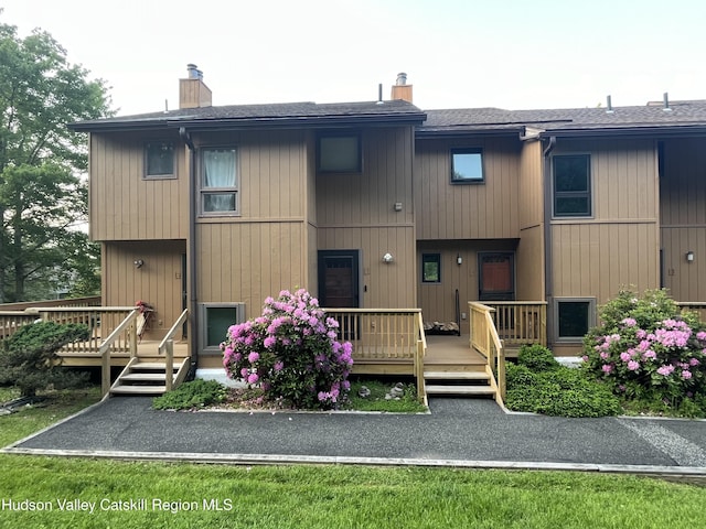 72 Hunter Dr Unit L-1, Hunter, NY 12442 - back of property with a chimney, a deck, and roof with shingles