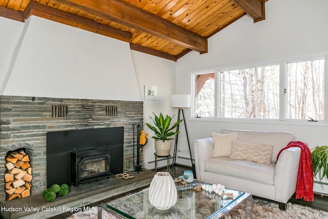 living room with a baseboard heating unit, wood ceiling, and lofted ceiling with beams