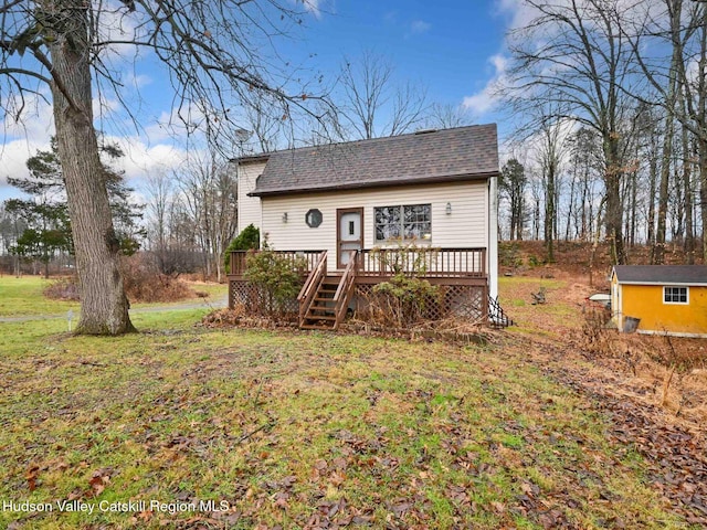 2846 Rte 32, Saugerties, NY 12477 - view of front facade featuring a storage unit, a front yard, and a wooden deck