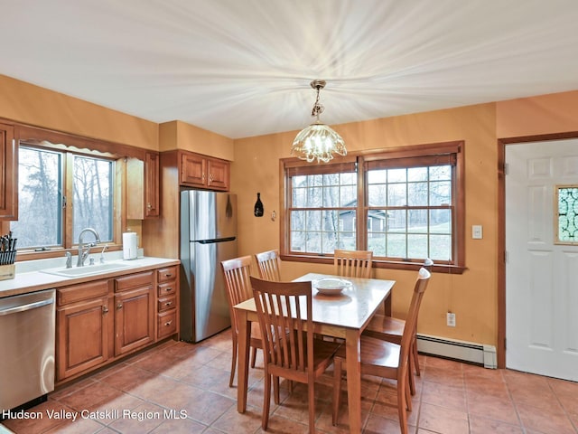2846 Rte 32, Saugerties, NY 12477 - tiled dining area featuring sink, a baseboard heating unit, and a notable chandelier