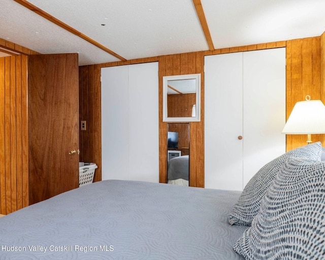 315 Begley Rd, Windham, NY 12496 - bedroom featuring wooden walls and multiple closets