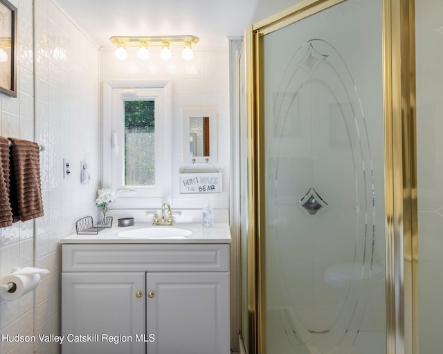 315 Begley Rd, Windham, NY 12496 - bathroom featuring vanity, a shower stall, and tile walls