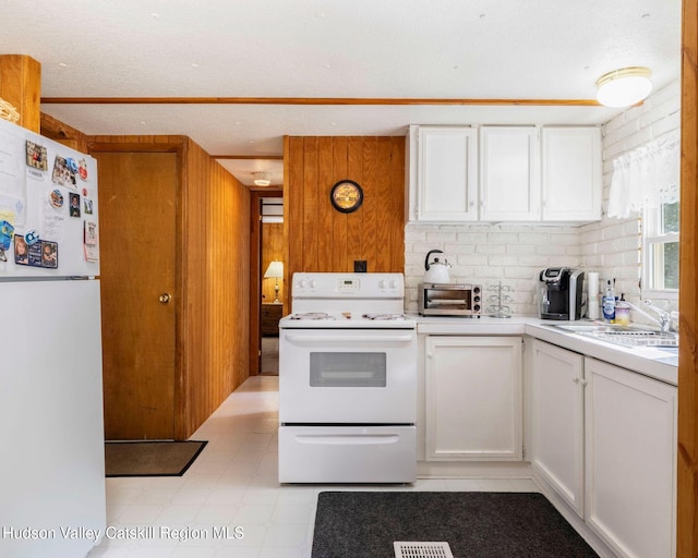 315 Begley Rd, Windham, NY 12496 - kitchen with white appliances, light countertops, and white cabinets