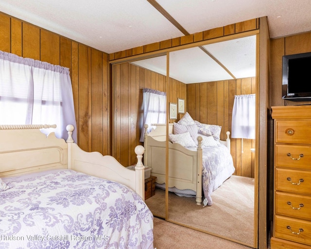 315 Begley Rd, Windham, NY 12496 - bedroom featuring carpet floors, a closet, and wood walls