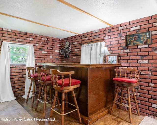 315 Begley Rd, Windham, NY 12496 - indoor dry bar featuring brick wall and a textured ceiling