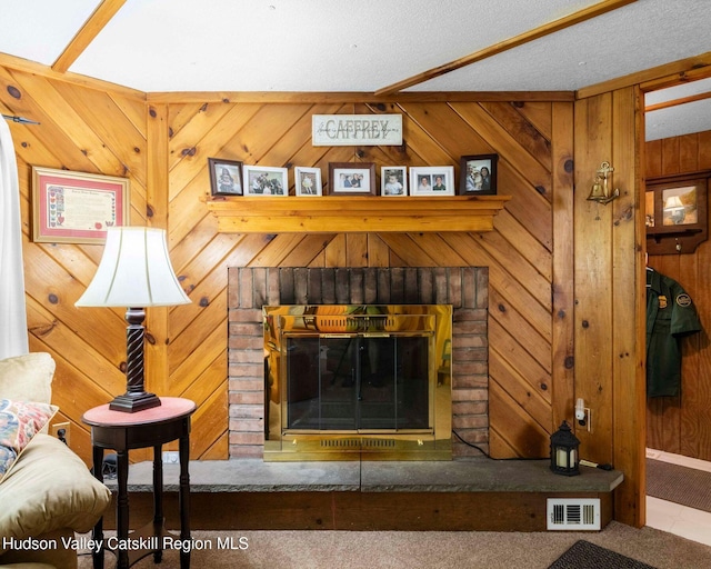 315 Begley Rd, Windham, NY 12496 - detailed view of wooden walls, carpet floors, a textured ceiling, and a brick fireplace