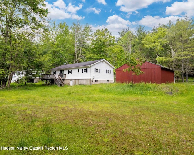 315 Begley Rd, Windham, NY 12496 - view of yard with a pole building, an outdoor structure, a wooden deck, stairway, and a view of trees