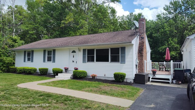56 Church St, Plattekill, NY 12589 - view of front of home with a front lawn, a chimney, and a deck