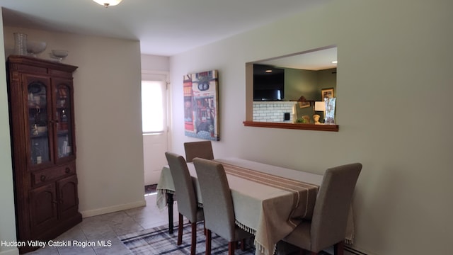 56 Church St, Plattekill, NY 12589 - dining area with tile patterned flooring and a baseboard heating unit