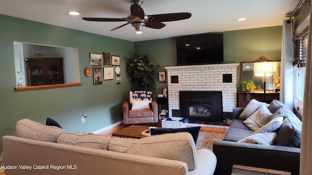 56 Church St, Plattekill, NY 12589 - living room with wood finished floors, a ceiling fan, recessed lighting, a brick fireplace, and baseboards