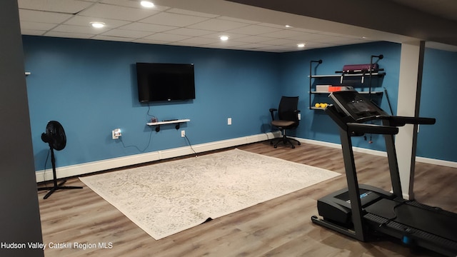 56 Church St, Plattekill, NY 12589 - workout room with a baseboard radiator, baseboards, wood finished floors, and a drop ceiling