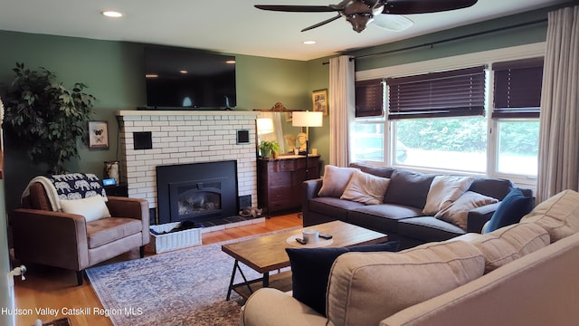 56 Church St, Plattekill, NY 12589 - living room with a ceiling fan, wood finished floors, a brick fireplace, and recessed lighting