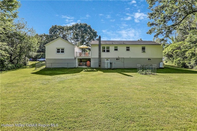 56 Church St, Plattekill, NY 12589 - rear view of property featuring a lawn and a wooden deck