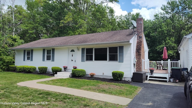 56 Church St, Plattekill, NY 12589 - view of front of home with a front lawn, a chimney, and a deck