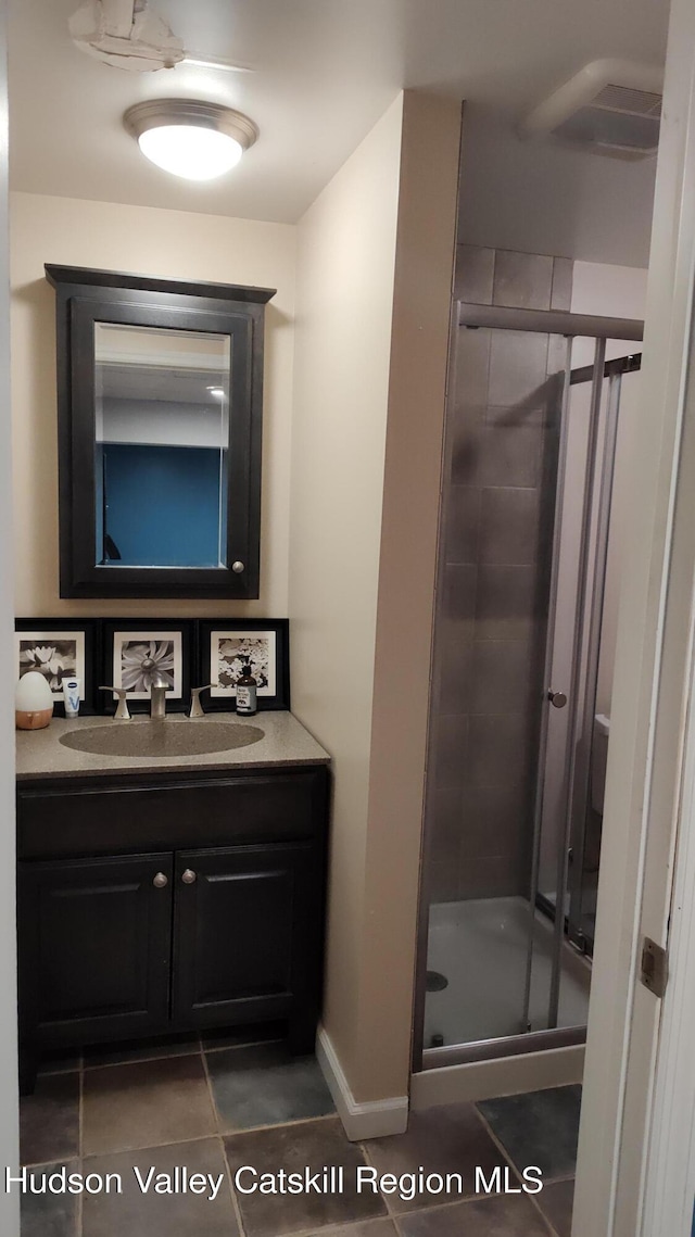 56 Church St, Plattekill, NY 12589 - full bathroom with vanity, a shower stall, tile patterned floors, and baseboards