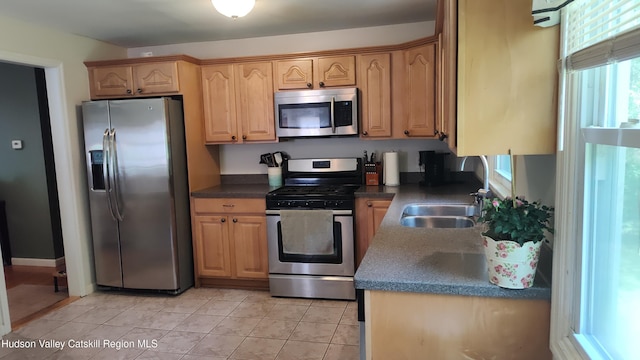 56 Church St, Plattekill, NY 12589 - kitchen with appliances with stainless steel finishes, a sink, dark countertops, and light tile patterned floors