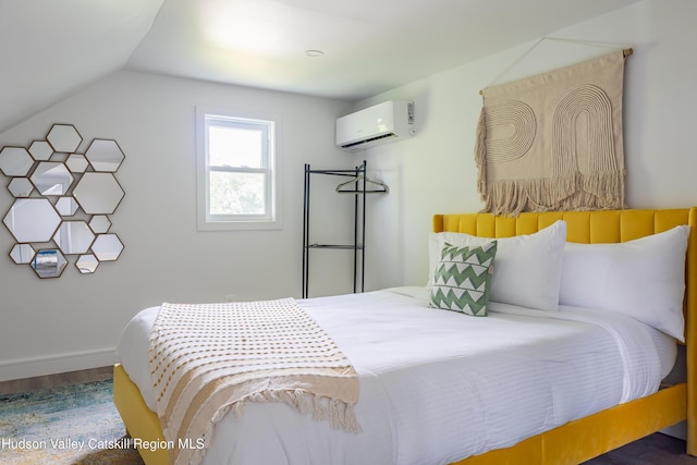 bedroom with hardwood / wood-style flooring, lofted ceiling, and a wall unit AC