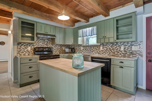 kitchen with a center island, backsplash, black appliances, green cabinets, and beam ceiling