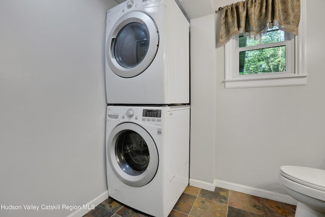 laundry area with stacked washer / dryer