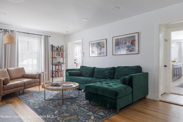 living area featuring hardwood / wood-style flooring, baseboards, and recessed lighting