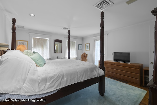 bedroom featuring visible vents, recessed lighting, and wood finished floors