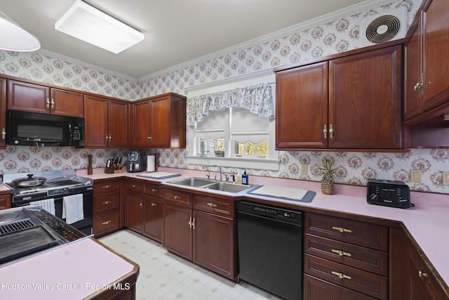 kitchen with wallpapered walls, a sink, black appliances, and light floors