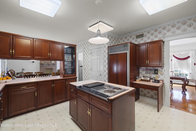 kitchen with light floors, paneled built in refrigerator, and wallpapered walls