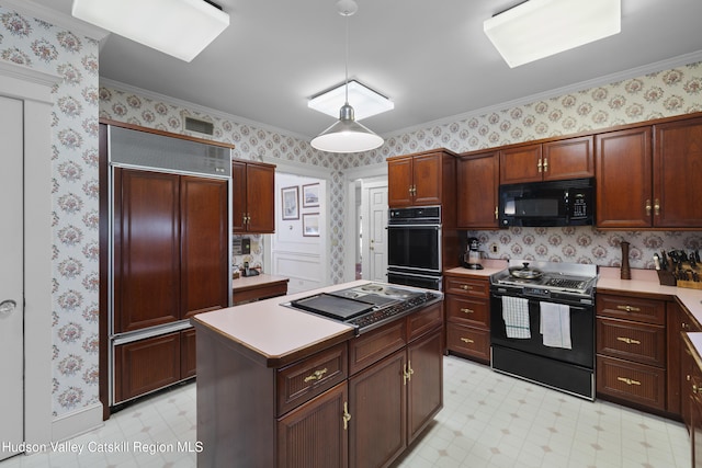 kitchen featuring a kitchen island, black appliances, light floors, ornamental molding, and wallpapered walls