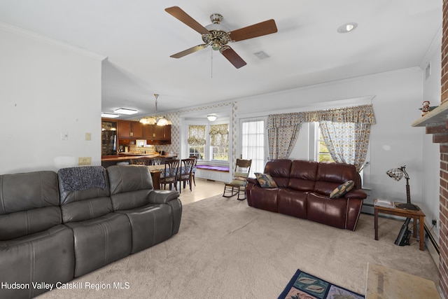 living area featuring ornamental molding, a ceiling fan, and light colored carpet
