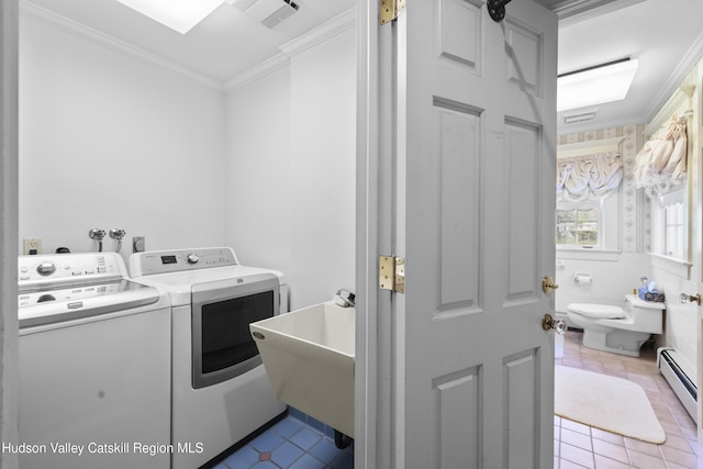 washroom with laundry area, ornamental molding, tile patterned flooring, visible vents, and washer and dryer