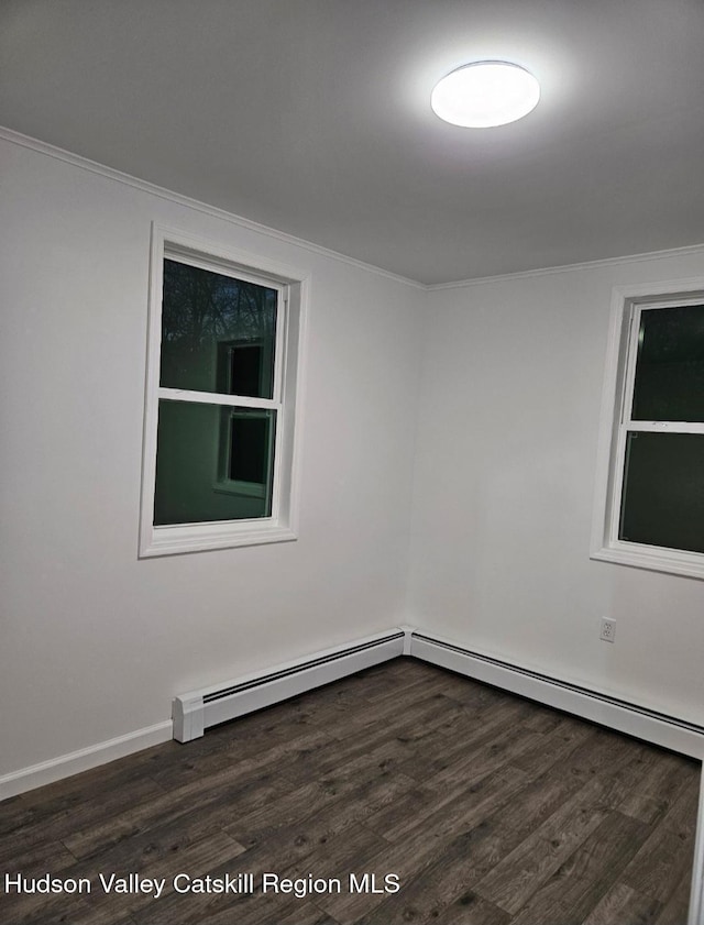 unfurnished room featuring baseboards, dark wood-type flooring, and ornamental molding