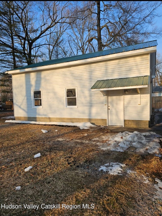 exterior space featuring metal roof