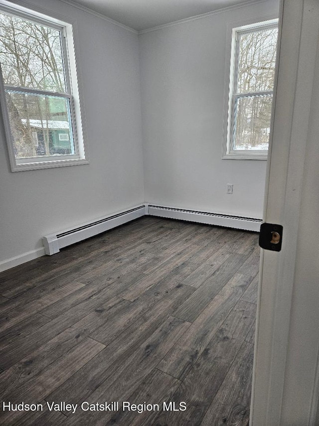 empty room featuring crown molding and dark wood-style flooring