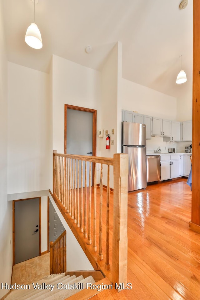28 Loo Bridge Ln Unit 22A, Windham, NY 12496 - stairs featuring hardwood / wood-style floors