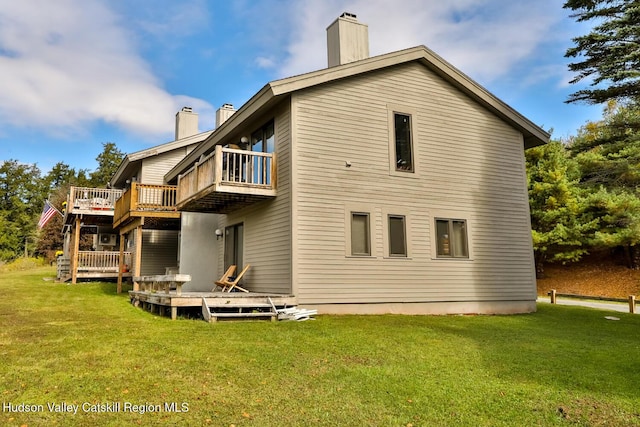 28 Loo Bridge Ln Unit 22A, Windham, NY 12496 - back of property featuring a chimney, a balcony, and a yard