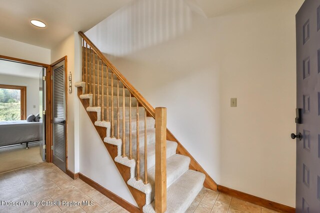 28 Loo Bridge Ln Unit 22A, Windham, NY 12496 - stairway featuring baseboards