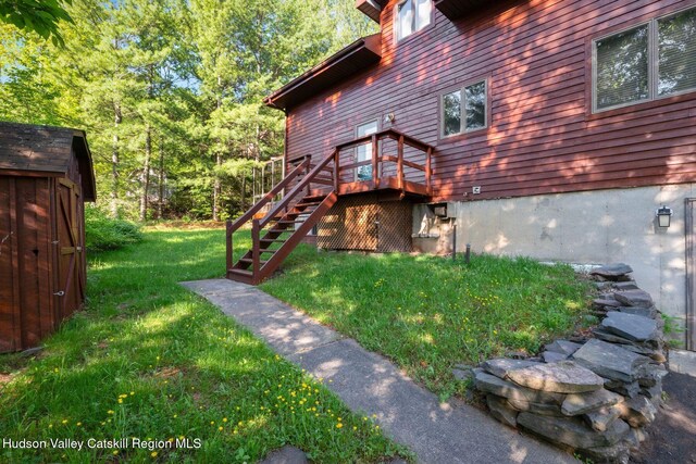 59 Mountain Dr, Hunter, NY 12442 - view of home's exterior featuring stairs, a yard, a deck, and an outdoor structure