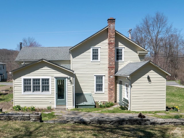 2456 State Route 82, Ancram, NY 12502 - back of property with a chimney and a shingled roof