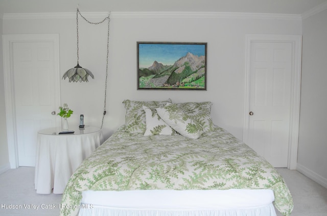 bedroom with light colored carpet and crown molding