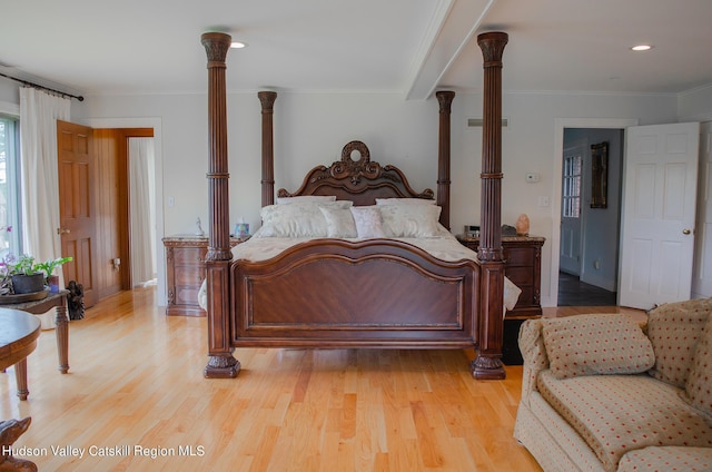 bedroom featuring light hardwood / wood-style floors and ornamental molding