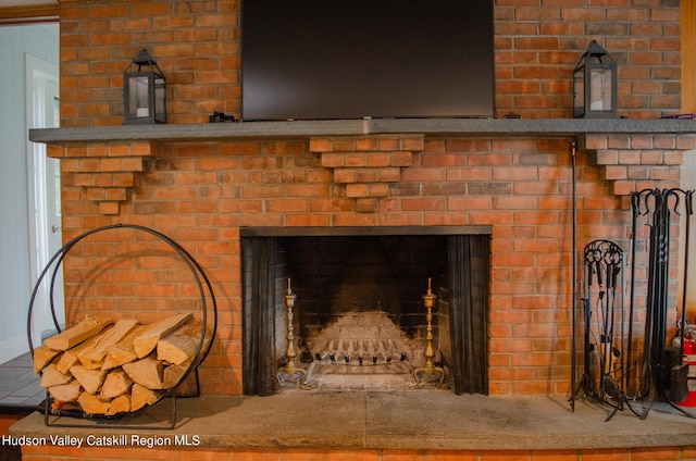 details featuring a brick fireplace