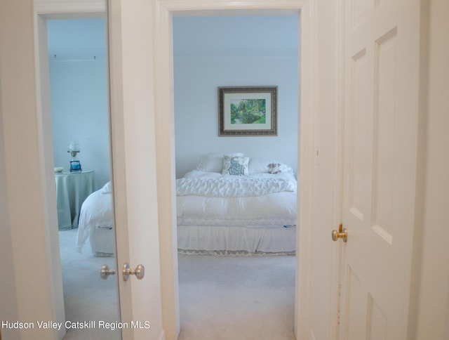 carpeted bedroom featuring ornamental molding