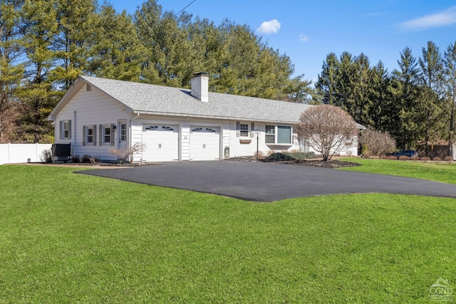 30 Clinton Hollow Rd, Pleasant Valley, NY 12578 - single story home with an attached garage, asphalt driveway, a chimney, and roof with shingles