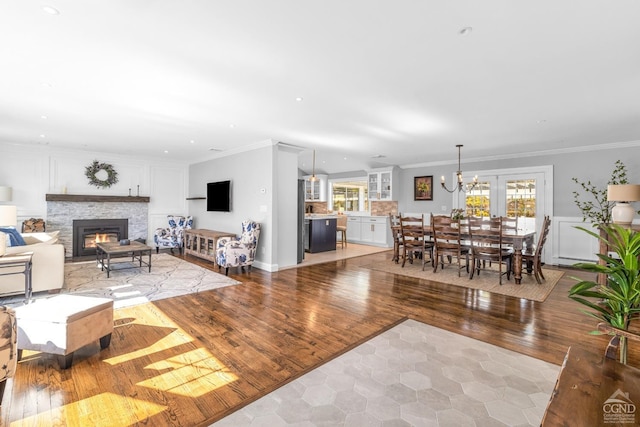 30 Clinton Hollow Rd, Pleasant Valley, NY 12578 - living area with a stone fireplace, ornamental molding, light wood-style flooring, a chandelier, and recessed lighting