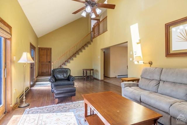 213 Botti Dr, Hunter, NY 12442 - living room with wood finished floors, high vaulted ceiling, a baseboard radiator, stairs, and ceiling fan
