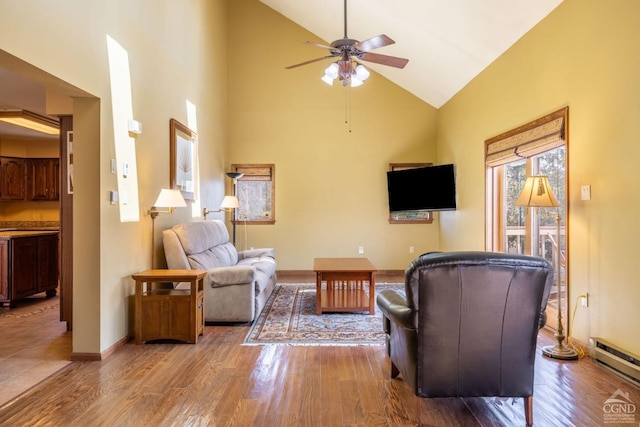 213 Botti Dr, Hunter, NY 12442 - living area featuring a baseboard heating unit, a ceiling fan, high vaulted ceiling, and wood finished floors