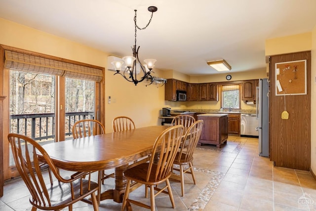 213 Botti Dr, Hunter, NY 12442 - dining space with a chandelier and light tile patterned flooring